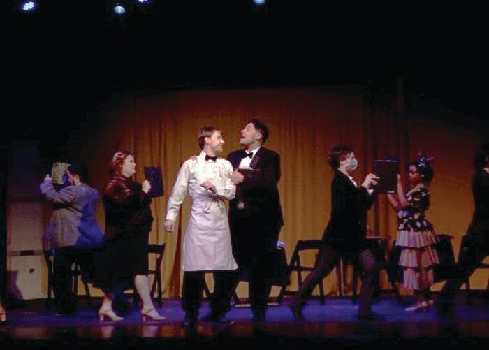 LOVE IS IN THE AIR:  Anthony De Rose (Head Waiter) and Nathan Pothier 
(Clumsy Bus Boy) 
with Ensemble dance their way through “A Romantic Atmosphere” in The Players at the Barker Playhouse musical, “She Loves Me.”